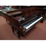 An early 20thC walnut cased concert grand piano, by C Bechstein, the shaped carcass with a hinged