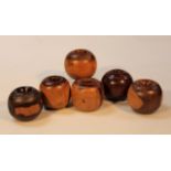 Various late 19thC/early 20thC bygone lignum vitia net weights, each of cylindrical form with