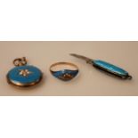 A near matching yellow metal and blue enamel jewellery set, to include pendant, ring and miniature