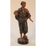 A 20thC bronzed figure, of a classical lady wearing flowing robes holding flowers on a circular part