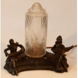 A 20thC metal freestanding pierrot style lamp, with the central bulb flanked by two figures