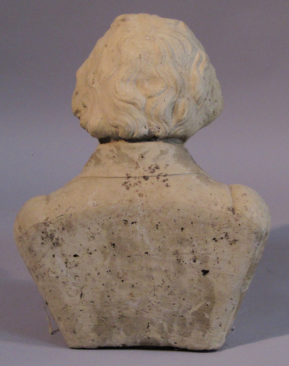 A 20thC stone bust of Ludwig Van Beethoven, quarter profile in typical pose with head down, unsigned - Image 2 of 2