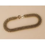 A ladies bracelet, with orb and 'S' chain links with a plain clasp end, yellow metal marked 9.375,
