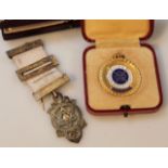 A Masonic style gilt metal medal, with cloth ribbon and metal mounts, 10cm high and a Royal Life