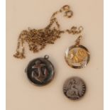 A pendant charm, with circular outline centred by a pierced lion with ring top, marked 9k, 1.7g,