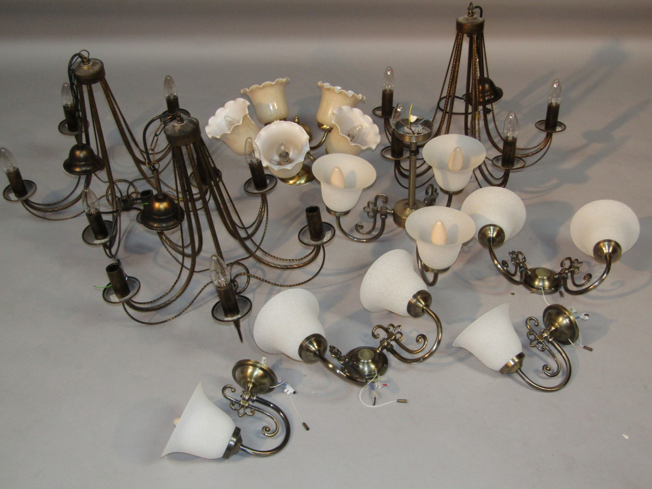 Various 20thC electroliers, to include two similar five branch examples, with glass candle bulbs,