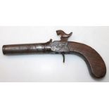 A 19thC walnut handled muff pistol, with metal trigger and mounts, part etched with scrolls,