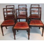 A set of six 19thC mahogany dining chairs, each with scroll backs and cylindrical part fluted top