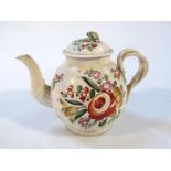 An 18thC Staffordshire creamware teapot, the bulbous body painted with various summer flowers