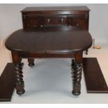 A 20thC oak Ercol style oblong extending dining table, the plain moulded outline raised on heavy