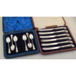 A cased set of six George V silver and plated butter knives, by Mosley & Co. with shell capped gun