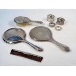 A George V silver hand mirror, by Daniel Manufacturing Co. with a plain outline initialed with the