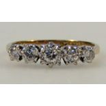 A ladies five stone diamond ring, graduated illusion claw set, on a yellow metal shank marked 18ct