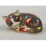 A Royal Crown Derby paperweight, Catnip Kitten, Collectors Guild in green, red and blue with gilt