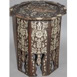 A late 19thC hardwood and mother of pearl finish occasional table, the octagonal top set with a