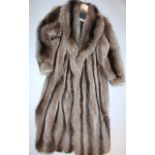 A late 20thC ladies three quarter length racoon fur jacket, with a black lining, size unknown.