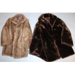 A ladies three quarter length fur coat, and another faux fur coat, sizes unknown. (2)