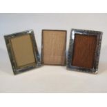 Three various 20thC silver frames, each with oak easel backs, 17cm high, etc. (3)