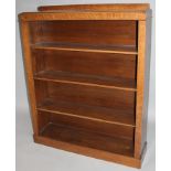 An Edwardian oak freestanding bookcase, with a galleried back raised above three removable