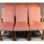 A set of ten mid-20thC oak framed open dining chairs, each upholstered in (later) pink material