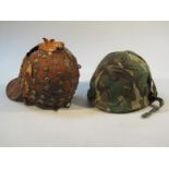 An unusual metal peaked helmet, with a part beadwork to the bulbous top, with a moulded front,