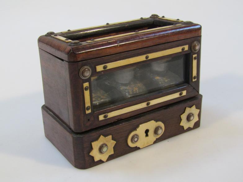 A 19thC rosewood three bottle travelling case, the exterior with bone inlay in a two sided glass