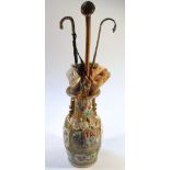 A 19thC Cantonese famille rose vase, with a shaped floral outline the neck and body decorated with