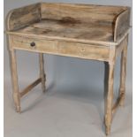 A late 19thC stripped pine wash stand, with a three part galleried back raised above two drawers