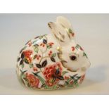 A Royal Crown Derby paperweight, Meadow Rabbit, Collectors Guild predominately in orange, blue and
