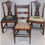 A pair of Edwardian Chippendale revival mahogany dining chairs, each with a shaped back rails