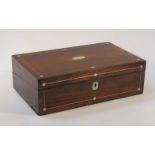 A 19thC rosewood cased writing slope, the rectangular lid with mother of pearl mounts, hinging to