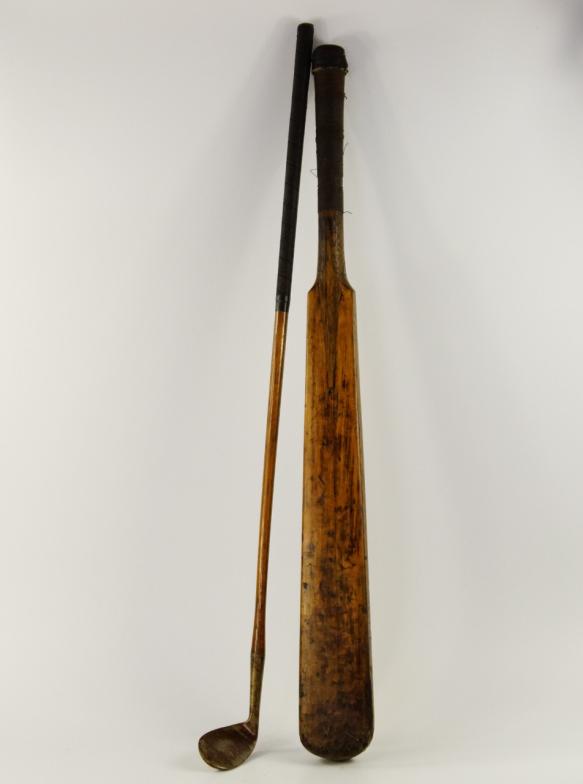 A 19thC cricket bat, and a hickory shafted golf club, (2).