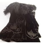 A black velvet cape, with hand beadwork decoration and Afghan fur collar.