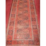 A 19thC Bokhara bordered rug, 216 x 106cm