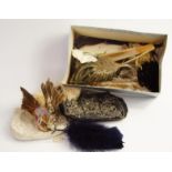 Two vintage evening bags, a collection of feather adornments and a fan.