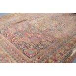 A 19thC Persian bordered carpet, with central stylized floral medallion and floral motifs and sprigs