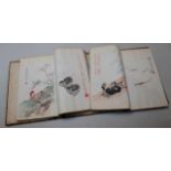 A collection of Japanese wood block prints, on rice paper in two albums in a fitted case, various