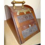 An Edwardian mahogany coal box, with cylindrical brass upper handle and articulated front door,