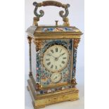 A late 19thC French gilt brass and champleve enamel striking and repeating carriage clock, the