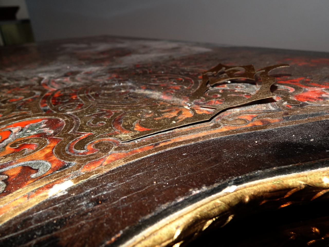 A 19thC French Boulle ebonised and ormolu games table, with serpentine outline the top fronted by - Image 5 of 5