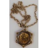A Victorian gold full sovereign, dated 1860, contained in a 9ct gold star pendant attached to a