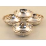 A set of four George VI silver Armada dishes, by S & Co. each with a beadwork outline and a part