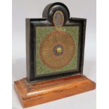 An early 20thC UT Miles Obsta Tempus Fugit calendar, with a front metal plate, showing days and