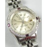 A Rolex Oyster Perpetual ladies wristwatch, with gem encrusted dial surround, set with diamonds