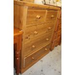 A modern stripped and lightly polished pine chest, of two short and three long drawers on a plain