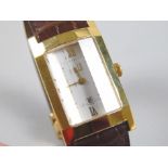 A Dunhill wristwatch, with rectangular dial and stainless steel back, and unusual faceted glass,