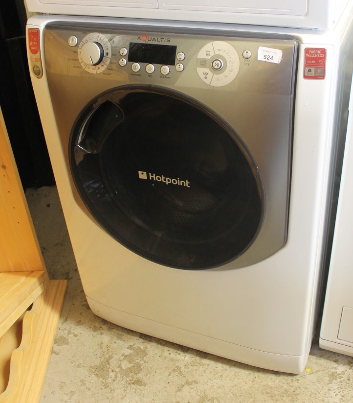 A Hotpoint Aqualtis 11kg AAA 1400 washing machine, 86cm high, 61cm wide, 65cm deep.