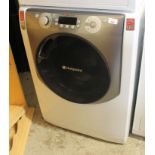 A Hotpoint Aqualtis 11kg AAA 1400 washing machine, 86cm high, 61cm wide, 65cm deep.