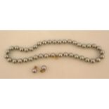 A cultured pearl necklace and earring set, with white metal mounts, marked 925.