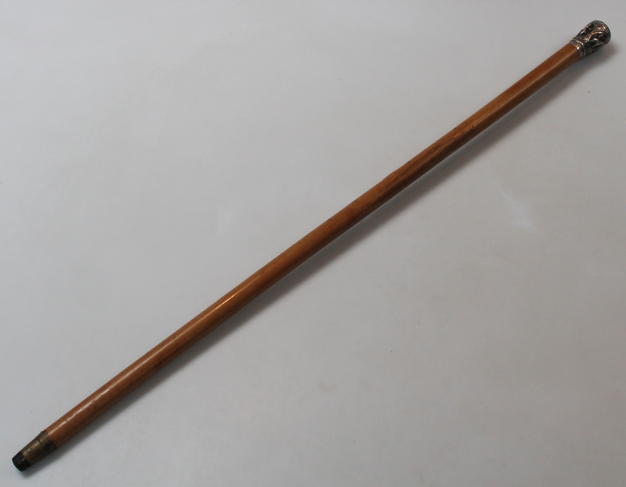 An early 20thC lightwood cane, the cylindrical stem headed by a knop raised with elephants and - Image 3 of 3